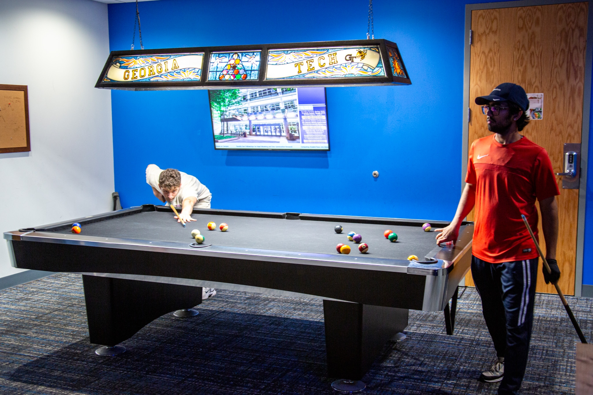 students playing billiards